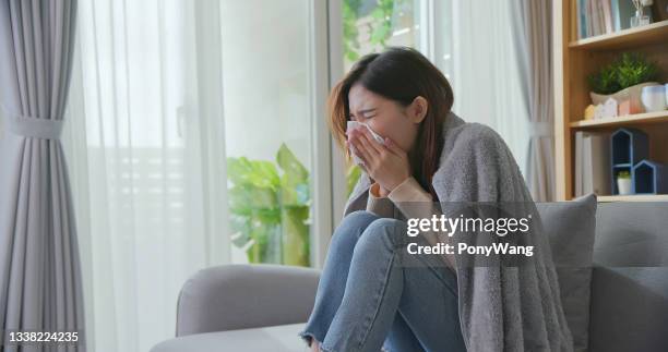 woman has running nose - allergie stockfoto's en -beelden