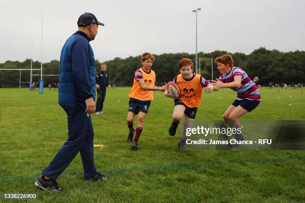 England Head Coach Eddie Jones coaches junior players of Wimbledon Rugby Club during the launch of the Pitch Up For Rugby campaign at Wimbledon RFC...