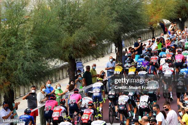 General view of the peloton passing through Sanxenxo village at start while fans cheer during the 76th Tour of Spain 2021, Stage 20 a 202,2km km...