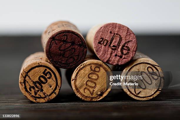set of five wine corks with various years engraved - wine cork stock pictures, royalty-free photos & images
