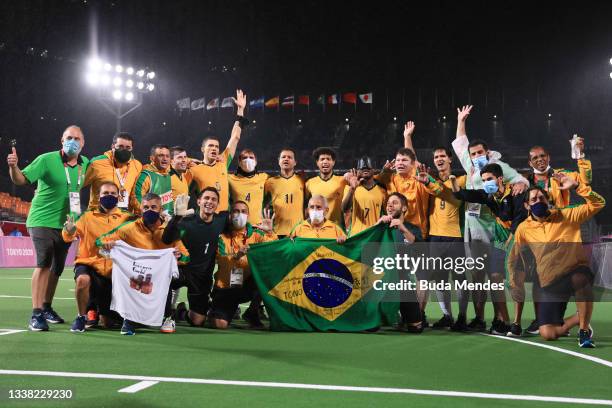 Players and coaching staff of Team Brazil celebrate after defeating Argentina in football 5-a-side gold Medal Match on day 11 of the Tokyo 2020...