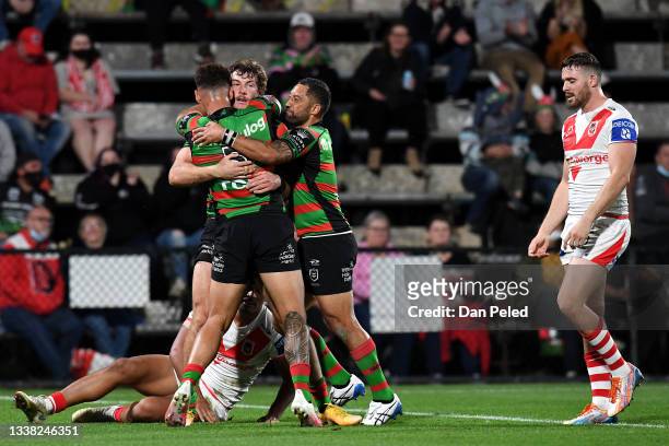 Benji Marshall of the Rabbitohs celebrates a try with teammates during the round 25 NRL match between the South Sydney Rabbitohs and the St George...
