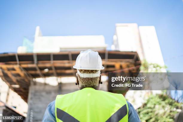 construction worker contemplating while working - dreams foundation stock pictures, royalty-free photos & images