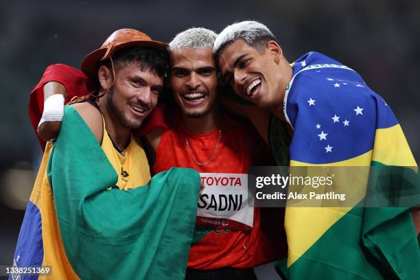 Petrucio Ferreira dos Santos of Team Brazil, Ayoub Sadni of Team Morocco and Thomaz Ruan de Moraes of Team Brazil celebrate after competing in the...