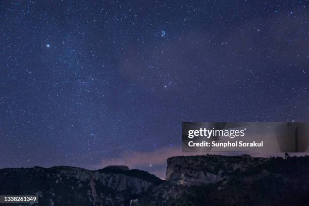 long exposure of night sky with milkway and mirador del lanchón, spain - cazorla stock pictures, royalty-free photos & images