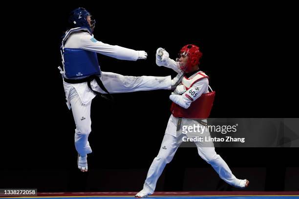 Nyshan Omirali of Team Kazakhstan competes with Rachid Ismaili Alaoui of Team Morocco during the Men K44 +75kg Repechage Quarterfinal match on day 11...