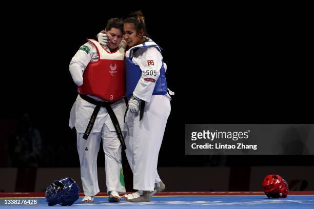 Guljonoy Naimova of Team Uzbekistan celebrates winning the gold medal after competes with Debora Bezerra de Menezes of Team Brazil during the Women...
