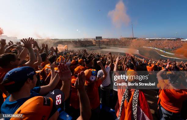 Fans celebrate Max Verstappen of the Netherlands driving the Red Bull Racing RB16B Honda during qualifying ahead of the F1 Grand Prix of The...