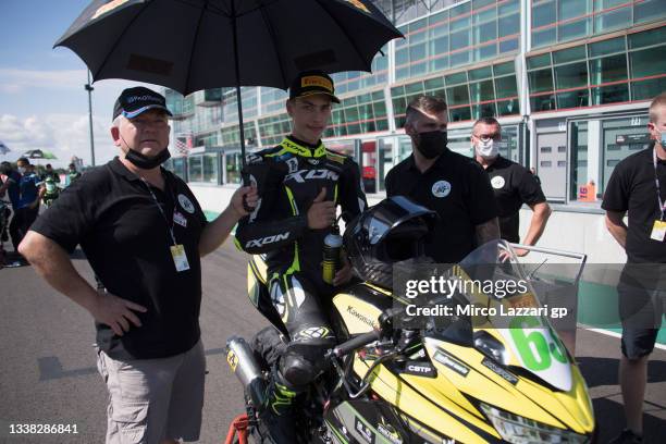 Diego Poncet of France and PMT Evolution greets and prepares to start on the grid during the WorldSSP300 race 1 during the WorldSBK France - Race 1...