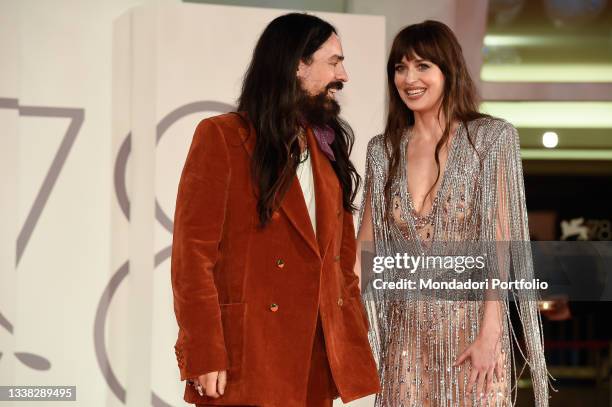 Italian fashion designer Alessandro Michele and american actress Dakota Johnson attends the red carpet permiere of 'The Lost Daughter' during the...