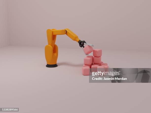robot hand stacking cubes - candy factory stockfoto's en -beelden