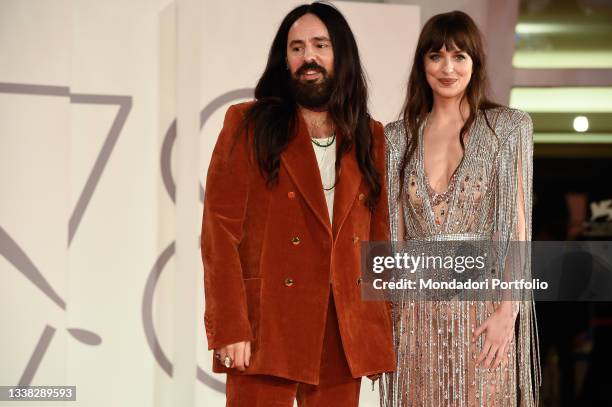 Italian fashion designer Alessandro Michele and american actress Dakota Johnson attends the red carpet permiere of 'The Lost Daughter' during the...