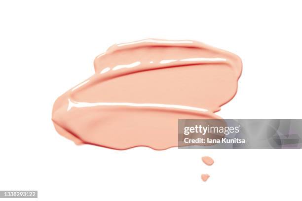 beautiful delicate pink smear of bb face cream on white background isolated. tonal foundation is smudged. products for makeup and skin care. organic cosmetics. cosmetology. closeup. - foundation make up stock pictures, royalty-free photos & images