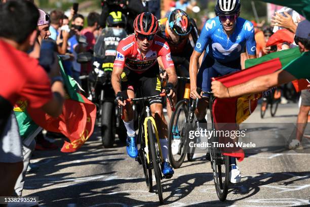 Primoz Roglic of Slovenia and Team Jumbo - Visma red leader jersey and Enric Mas Nicolau of Spain and Movistar Team attack in the breakaway while...