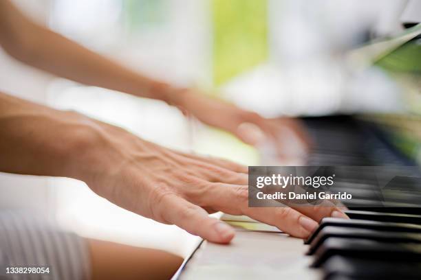 playing the piano, backgrounds - pianist stock pictures, royalty-free photos & images