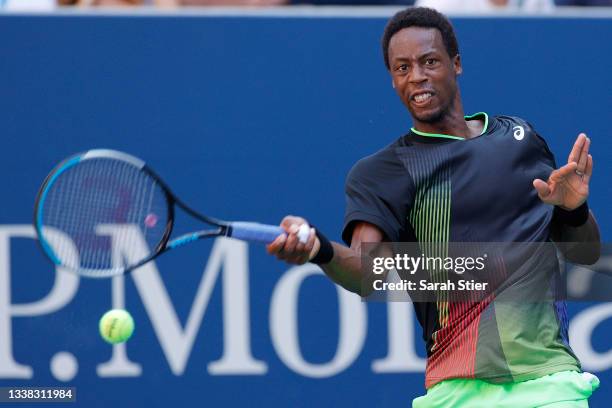 Gael Monfils of France returns against Jannik Sinner of Italy during his Men's Singles third round match on Day Six of the 2021 US Open at the USTA...