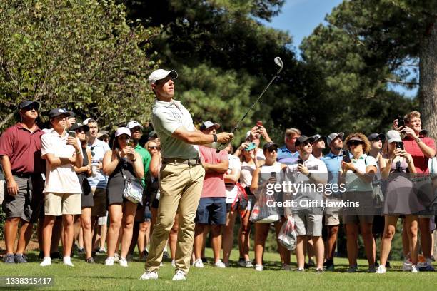 Rory McIlroy of Northern Ireland plays his shot on the seventh hole during the third round of the TOUR Championship at East Lake Golf Club on...