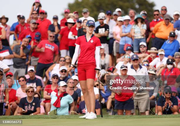 Nelly Korda of Team USA reacts to her putt on the 12th green during the Foursomes Match on day one of the Solheim Cup at the Inverness Club on...