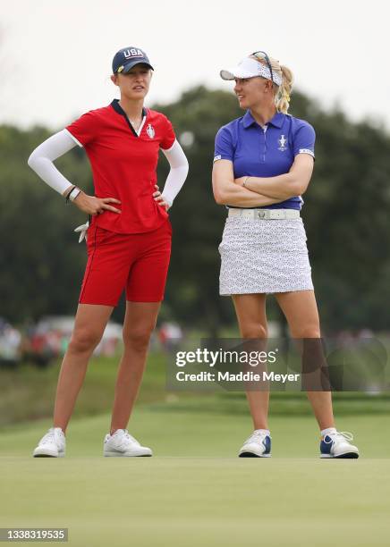 Nelly Korda of Team USA and Madelene Sagstrom of Team Europe during the Foursomes Match on day one of the Solheim Cup at the Inverness Club on...