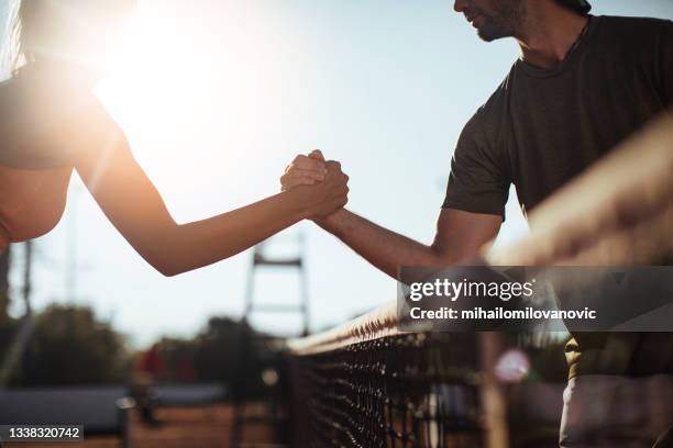 on court rivals, off court friends - sports team high five stock pictures, royalty-free photos & images