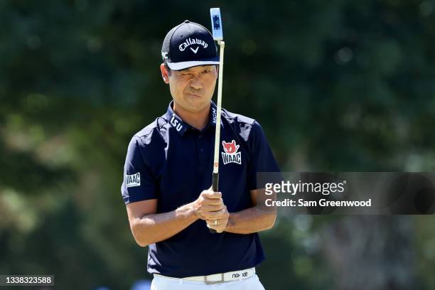 Kevin Na lines up a putt on the first green during the third round of the TOUR Championship at East Lake Golf Club on September 04, 2021 in Atlanta,...
