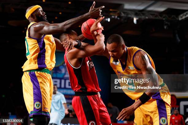 Isaiah Briscoe of the Trilogy handles the ball while being guarded by Reggie Evans and Rashard Lewis of the 3 Headed Monsters during the BIG3 -...