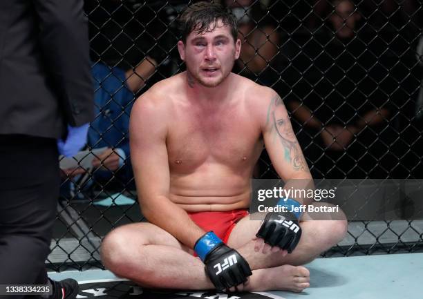 Darren Till of England reacts after his submission loss to Derek Brunson in their middleweight fight during the UFC Fight Night event at UFC APEX on...