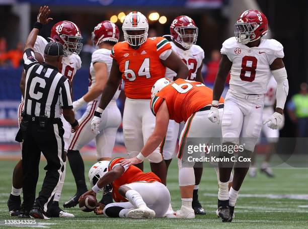 Christian Harris of the Alabama Crimson Tide reacts after sacking D'Eriq King of the Miami Hurricanes during the first half of the Chick-fil-A...