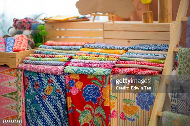 retail place tailor studio workplace tradition batik fabric fashion  workshop retail display - malaysia batik stock pictures, royalty-free photos & images