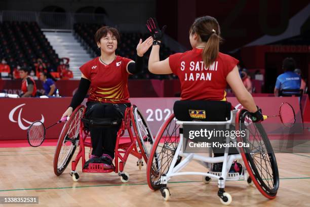 Sarina Satomi and Yuma Yamazaki of Team Japan celebrate a point during the Badminton Women's Doubles WH Gold Medal Match against Liu Yutong and Yin...