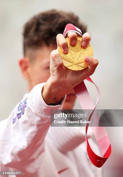 Gold medalist Nick Mayhugh of Team United States poses on the podium during the medal ceremony for the Men’s 200m - T37 Final on day 11 of the Tokyo...