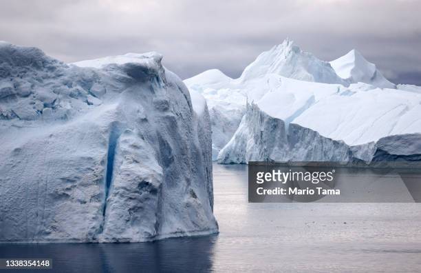 Icebergs which calved from the Sermeq Kujalleq glacier float in the Ilulissat Icefjord on September 04, 2021 in Ilulissat, Greenland. 2021 will mark...