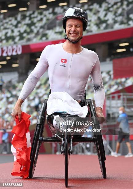 Marcel Hug of Team Switzerland reacts after victory in the Mens Marathon - T52 on day 12 of the Tokyo 2020 Paralympic Games at Olympic Stadium on...