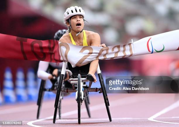 Madison de Rozario fo Team Australia crosses the finish line to win the women's Marathon - T54 on day 12 of the Tokyo 2020 Paralympic Games at...