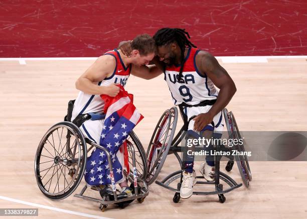 Michael Paye and Matt Scott of Team United States celebrate after defeating Team Japan during the men's Wheelchair Basketball gold medal game on day...