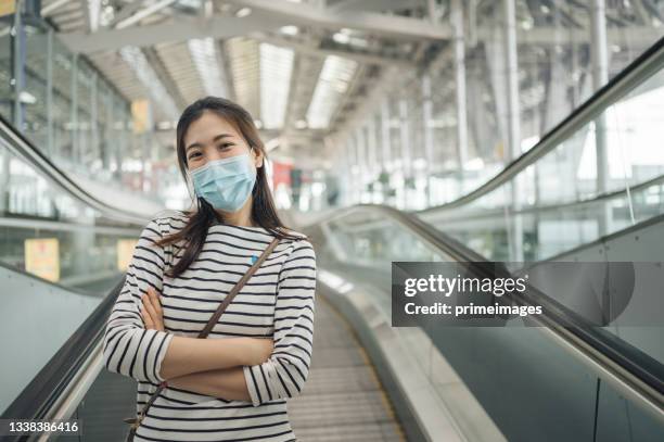 social distancing concept asian young family women cleaning her hand and wearing protective facemask during she shopping in discount store  new normal life style - heritage shopping centre stock pictures, royalty-free photos & images