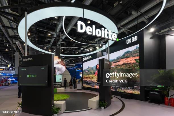 People visit Deloitte booth during the 2021 China International Fair for Trade in Services at China National Convention Center on September 4, 2021...