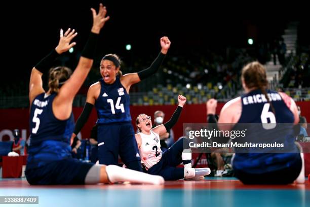 Kathryn Holloway, Kaleo Maclay, Bethany Zummo and Heather Erickson of Team United States celebrates a point during the Women's Sitting Volleyball...