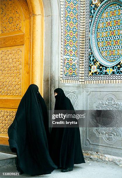 iranian women entering the mosque in qom,iran - qom stock pictures, royalty-free photos & images