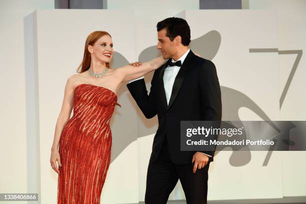 American actors Jessica Chastain and Oscar Isaac on the red carpet of the movie "Scenes From a Marriage " during the 78th Venice International Film...