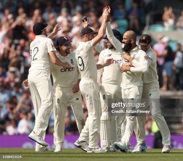 Moeen Ali of England is congratulated after taking the wicket of Virat Kohli of India during day four of the LV= Insurance test match between England...