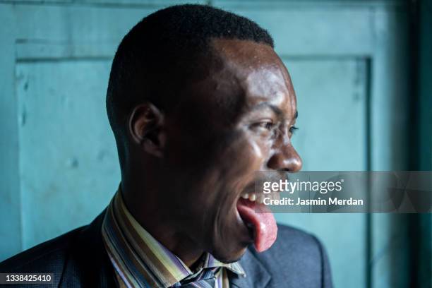 funny cheerful man portrait - man tongue stock pictures, royalty-free photos & images