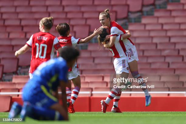 Vivianne Miedema of Arsenal FC celebrates with team mates after scoring their team's first goal during the Barclays FA Women's Super League match...