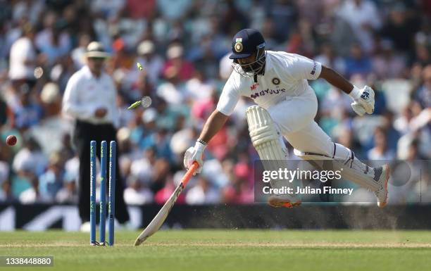 Rishabh Pant of India leaps to safety as the stumps are hit in a run out attempt by England during day four of the LV= Insurance test match between...