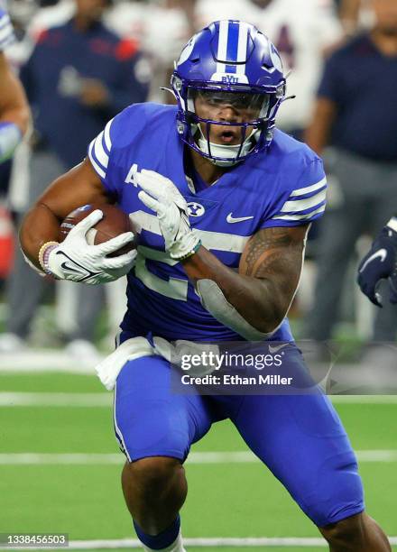 Running back Tyler Allgeier of the Brigham Young Cougars runs for a 15-yard touchdown against the Arizona Wildcats during the Good Sam Vegas Kickoff...