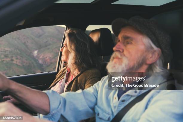 married couple in car during road trip - wife stock pictures, royalty-free photos & images