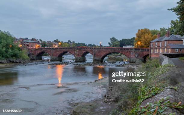 red light streaks over the old dee bridge - chester england fotografías e imágenes de stock