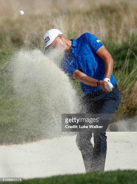 Adrian Meronk of Poland plays out of a bunker onto the 16th green during Day Four of The Italian Open at Marco Simone Golf Club on September 05, 2021...