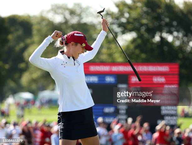 Nelly Korda of Team USA celebrates on the 13th green after her putt during the Foursomes Match on day two of the Solheim Cup at the Inverness Club on...