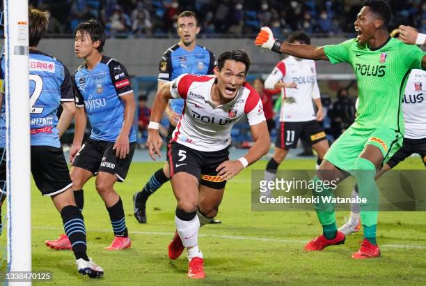 Tomoaki Makino of Urawa Red Diamonds celebrates scoring his team's third goal during the J.League Levain Cup quarter final second leg match between...